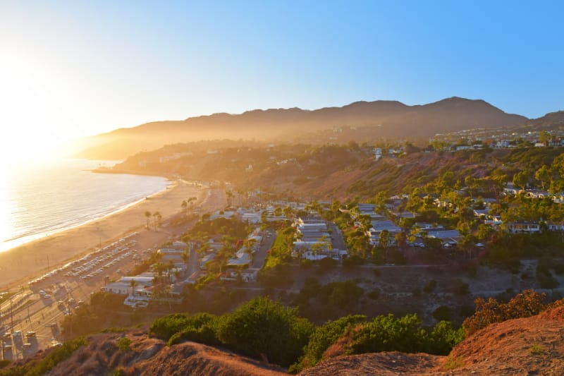 Aerial view of Pacific Palisades coastline with the Alphabet Streets and ocean bluffs, captioned with month/year
